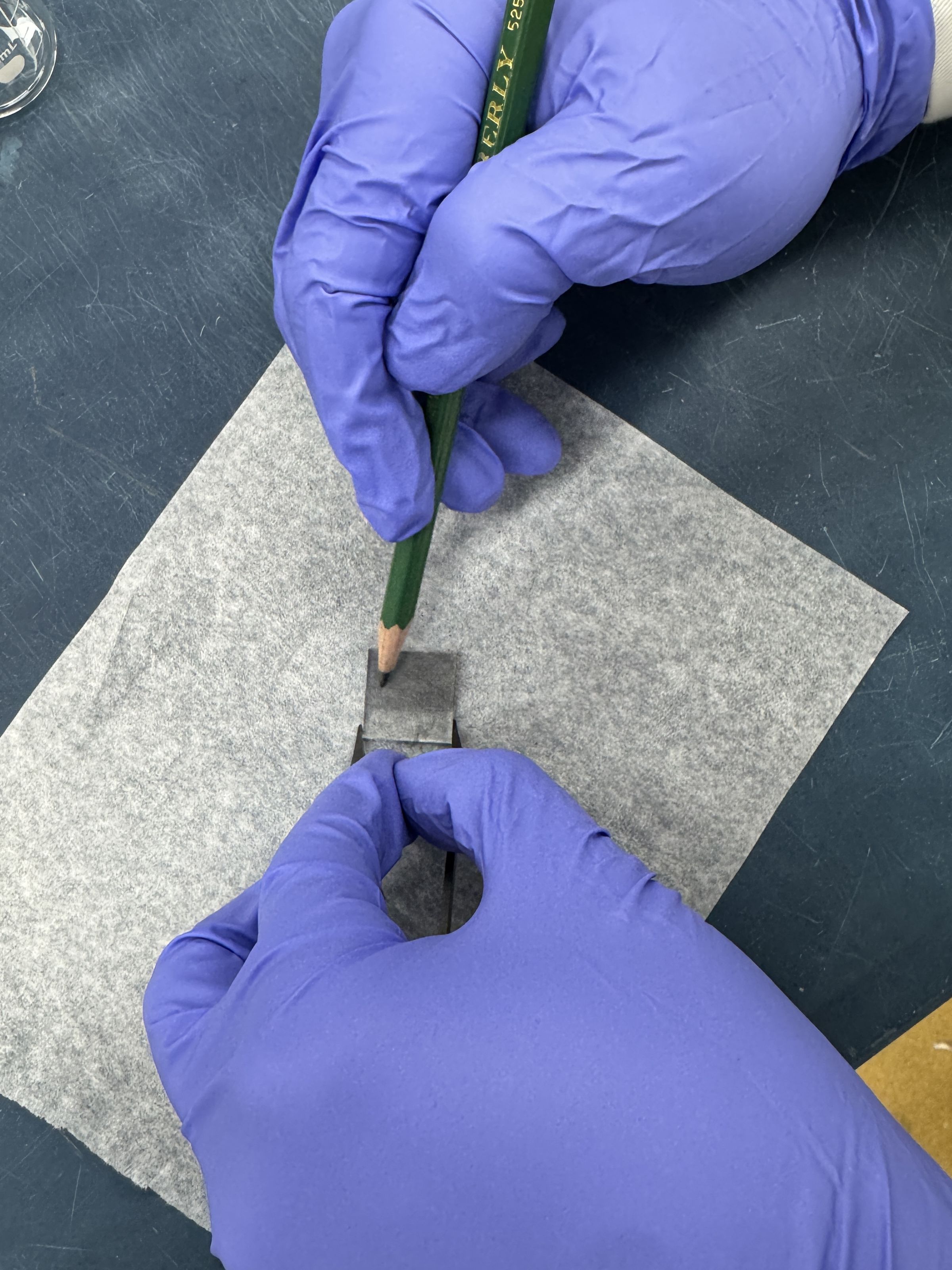 Graphite coating being deposited on FTO glass with a pencil