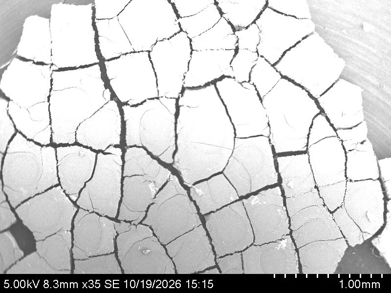 SEM image of the TiO2 film at 35 times magnification showing a crack network